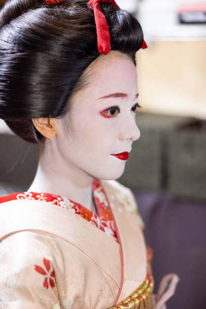 Close-up of Japanese Maiko (Geisha in training) getting dressed