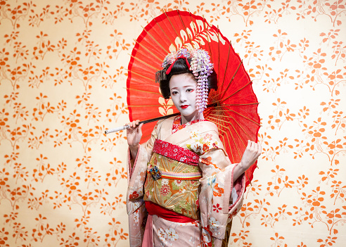 Japanese Maiko (Geisha in training) being photographed in studio