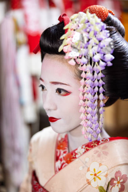 Close-up of Japanese Maiko (Geisha in training) getting dressed