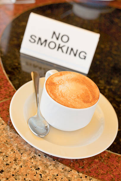 cup of cappuccino  on no-smoking table