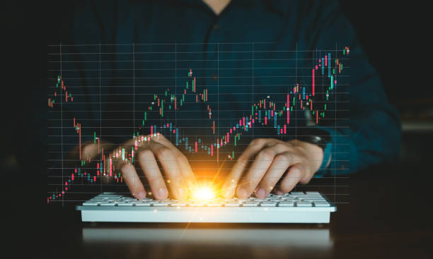 istock Business man use computer on desk with Investment analysis and stock graph analytic. 1494320784