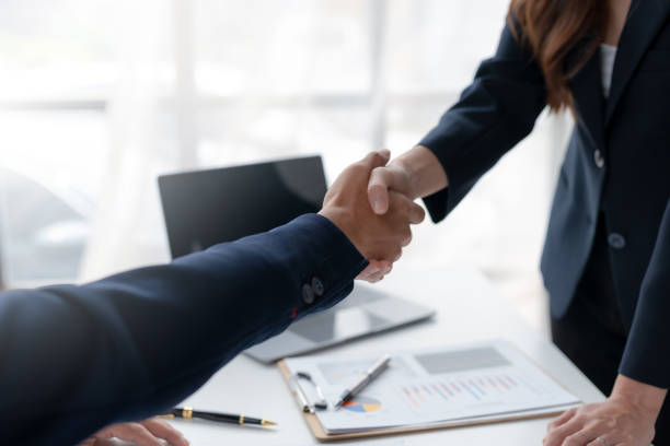 Business success. Business people handshake agreement confirmed in the investment business. Successful business people meeting together. stock photo