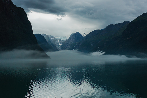 Scenic view of lake in Norwegian mountains in fog