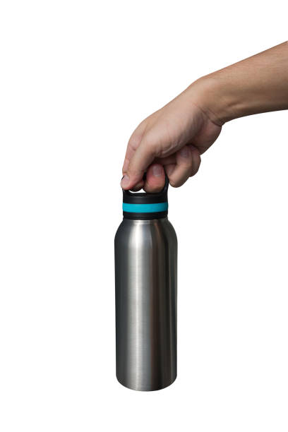 istock Hand holding stainless steel water bottle isolated on white background. 1494325006