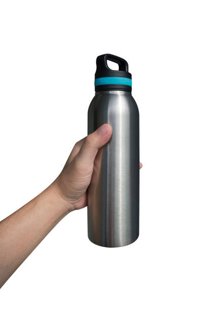 istock Hand holding stainless steel water bottle isolated on white background. 1494325044