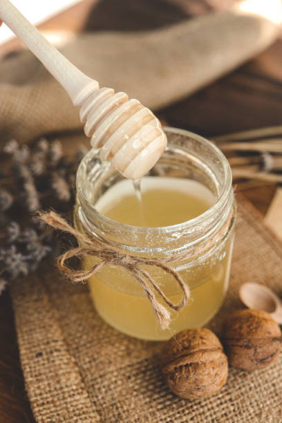 istock Wooden stick for honey close-up with honey 1494325552