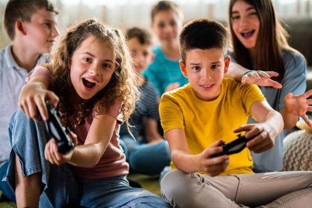 istock Children playing video games at home 1494326052