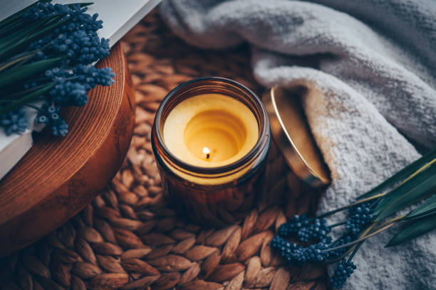 istock Candle and flowers in home atmospheric interior 1494326167