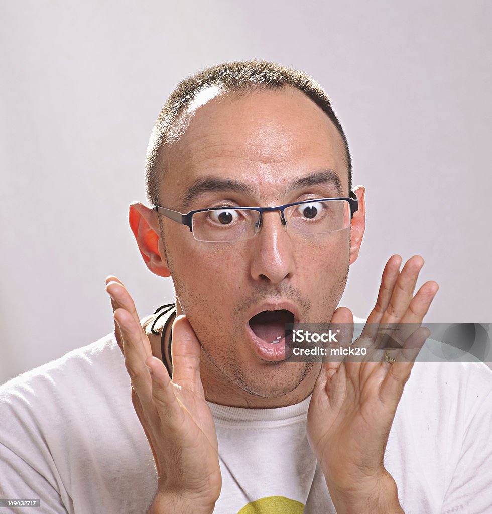 young man with expressive face young man with expressive face and surprise Adults Only Stock Photo