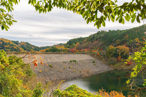 Minoh Park Minoogawa Dam lake with autumn leaves in Osaka, Japan