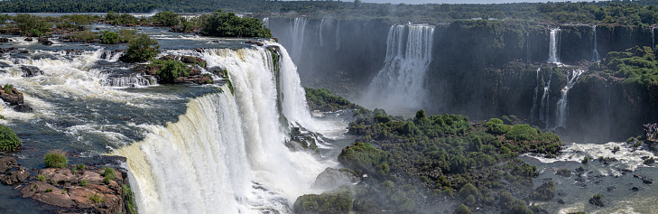 The Iguazu Falls with their cascading waters and misty atmosphere offer a dreamlike and ethereal ambiance