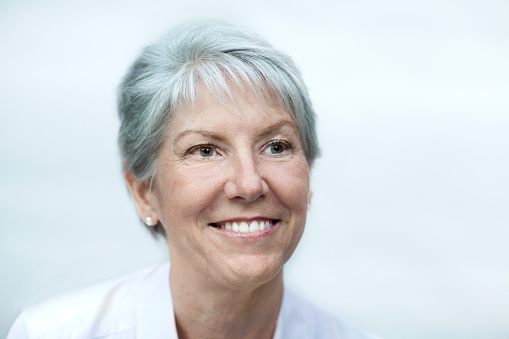 Portrait of Caucasian senior woman smiling looking away ahead