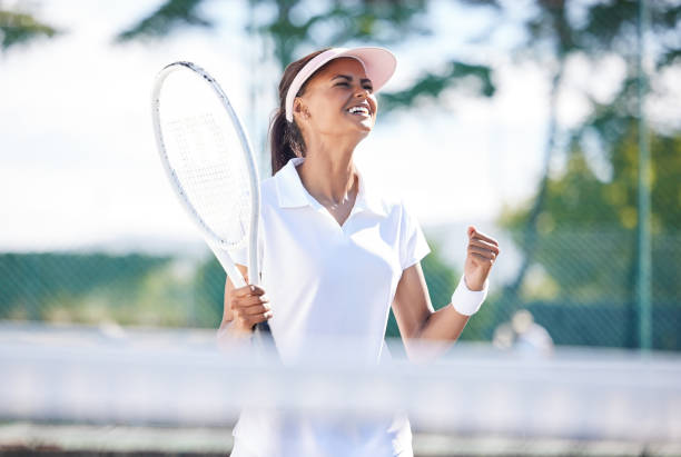 istock Winner, celebrate and female tennis player playing a match, training or practicing on an outdoor court. Sports, fitness and woman athlete winning at game, exercise or workout at stadium with victory. 1494329727