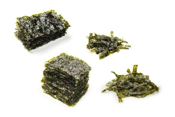 istock Tasty nori seaweed isolated on white. 1494331034