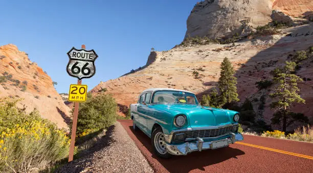 Vintage car oldtimer driving through National Park USA on Route 66