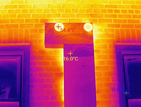 Ventilation pipe lining in Infrared Thermal specter. Inspecting of Thermal insulation on house facade. The brighter part is the most emitted heat
