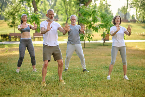 istock A group of people practicing qigong in a park 1494335581