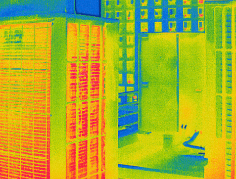 Multicolored Infrared Thermal photo of Air Conditioning unit sets on the rooftop of the building