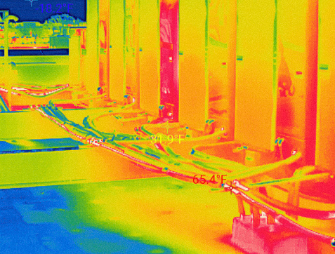Split System and pipelines and air ducts on the rooftop in Infrared specter. Fahrenheit temperature measurements  in different parts of air ducts of split system on the building roof