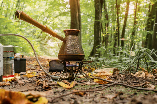 istock Copper cezve in the forest on the ground, making coffee in nature 1494337232