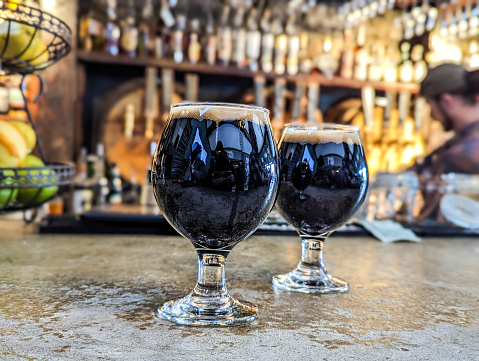 dark stout beer in glass at the brewery