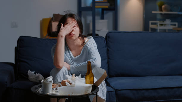 istock Fatigued upset young woman massaging forehead bridge 1494342007