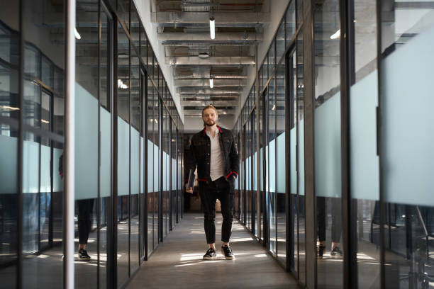 istock Young man looking at camera in corridor 1494342443