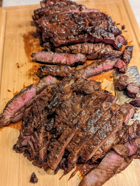 istock Beef steaks on wooden board ready to eat 1494343665
