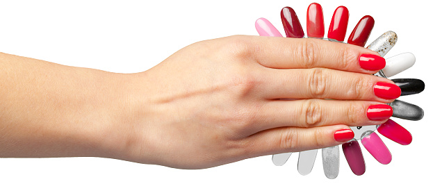 Female hand with nail polish isolated on white