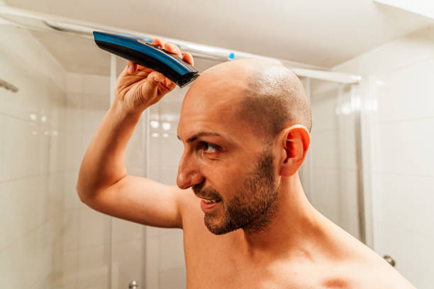 istock Man getting a self haircut at home 1494345368