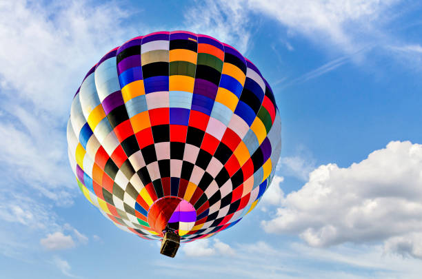 istock Hot air balloon flight over blue sky 1494345511