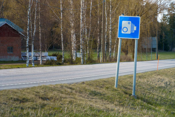 Blue speed camera traffic sign in countryside Finland.