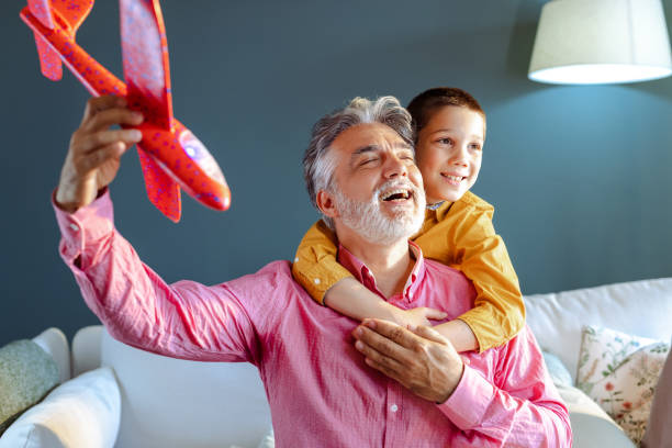 istock Joyful different generations family playing together at home 1494347115