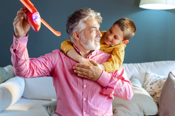 istock Joyful different generations family playing together at home 1494347309