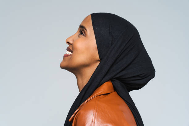 Beautiful arab middle-eastern woman with traditional abaya in studio