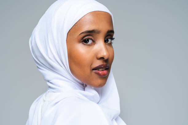 Beautiful arab middle-eastern woman with traditional abaya in studio