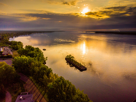 Aerial view of sunrise over St. Lawrence river during summer in Trois-Rivieres