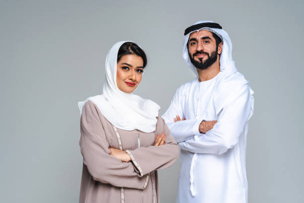 istock Beautiful arab middle-eastern couple with traditional emirate clothes in studio 1494353051