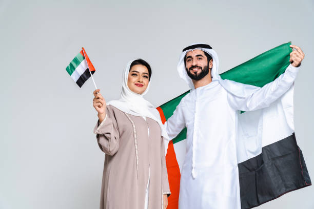 istock Beautiful arab middle-eastern couple with traditional emirate clothes in studio 1494353181