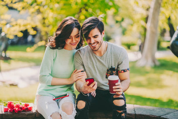 istock Couple in love taking selfie outside 1494356189