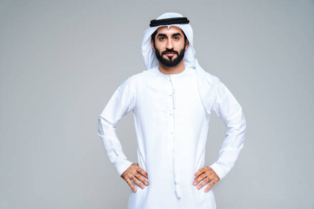 Handsome arab middle-eastern man with traditional kandora portrait in studio stock photo
