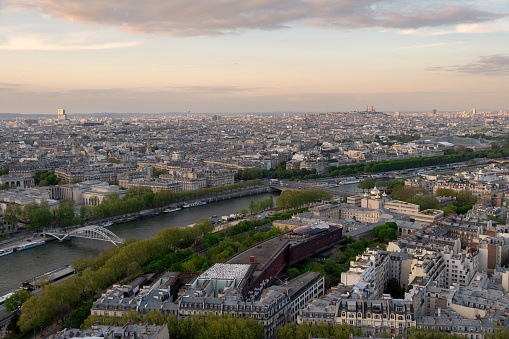 Paris aerial panorama with river Seine and Mont Martre, France. Romantic summer holidays vacation destination. Panoramic view above historical Parisian buildings and landmarks with sunset sky