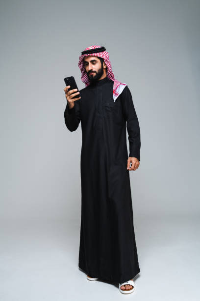 istock Handsome saudi arabian middle-eastern man with traditional thwab portrait in studio 1494359287