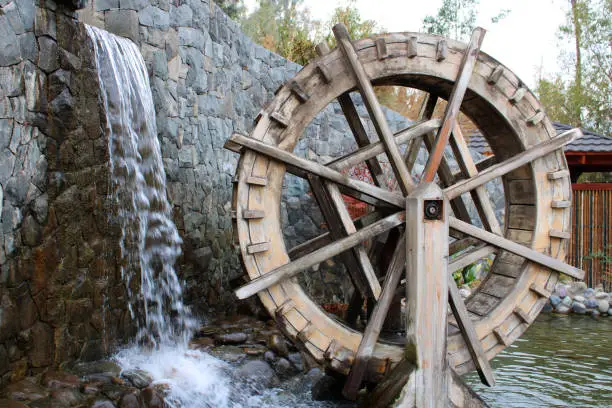 Wooden wheel and waterfall in Japanese Garden, San Cristobal hill