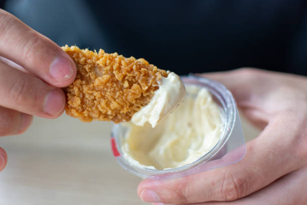 istock Fried spicy chicken wings with white sauce 1494363275