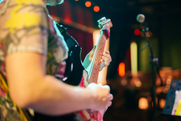 Musicians playing guitar on stage stock photo
