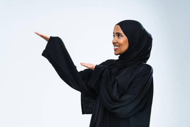 istock Beautiful arab middle-eastern woman with traditional abaya in studio 1494364746