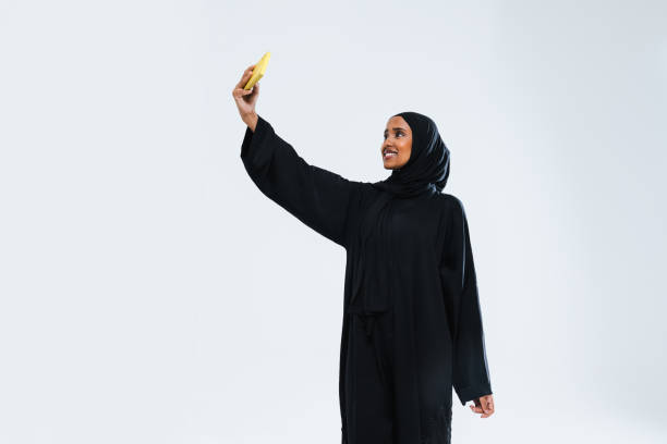 istock Beautiful arab middle-eastern woman with traditional abaya in studio 1494364859