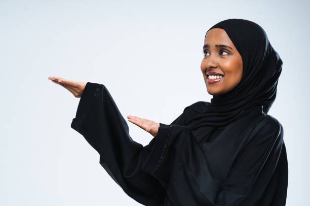 istock Beautiful arab middle-eastern woman with traditional abaya in studio 1494365707