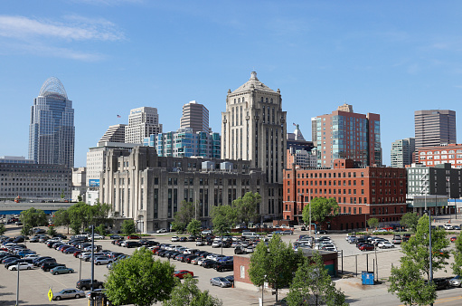 Buffalo, New York, USA - June 18, 2022: Downtown Buffalo’s cityscape rises behind a residential building adjacent to the Erie Basin Marina near the Niagara River.